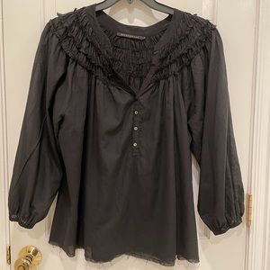 DEVELOPMENT BLACK COTTON BLOUSE WITH FRINGE DETAIL AT THE NECK SIZE 6 .